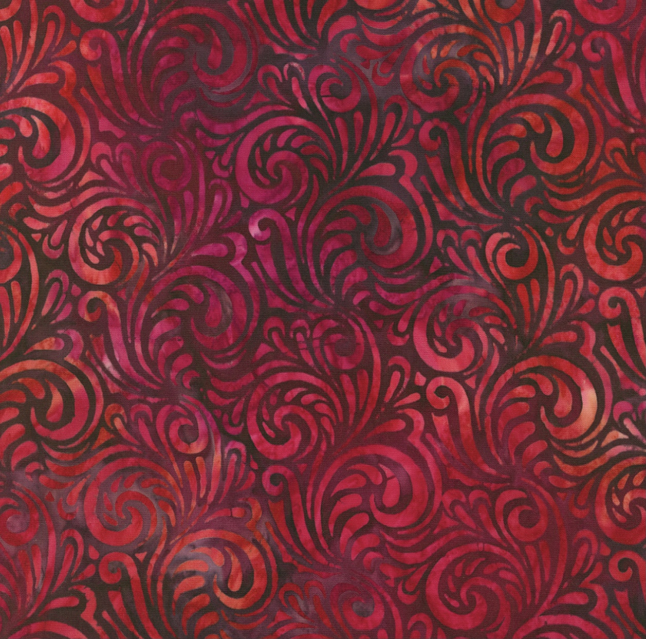 Ein wunderschöne, dunkelrote Batikstoff mit schwungvollen Muster.